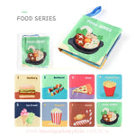 Livro sensorial com o tema Comidas. Capa ilustrada com uma tigela de comida variada. Páginas internas apresentam alimentos como hambúrguer, pizza, sorvete e pipoca.