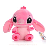 Stitch Angel Rosa com 20 cm em plush macio sentado de frente ideal para presentear ou decorar quarto infantil.