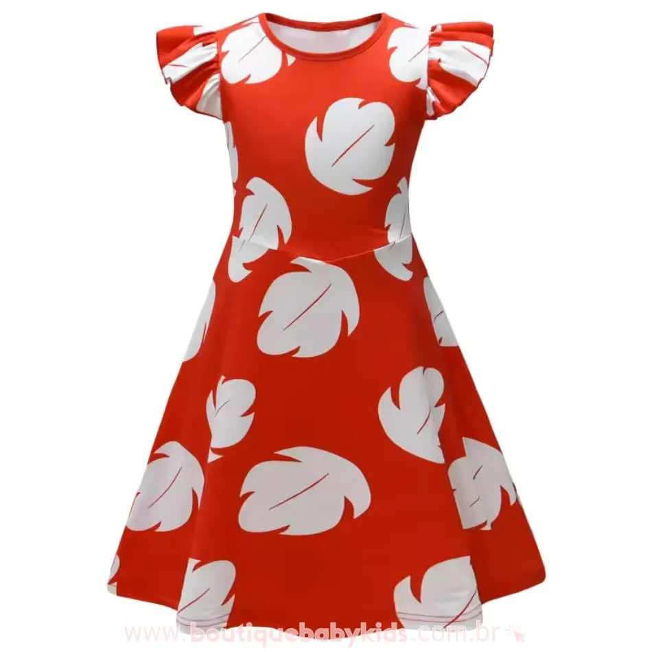 Vestido Infantil Temático Lilo Havaiana em destaque, com folhas brancas e fundo vermelho vibrante.